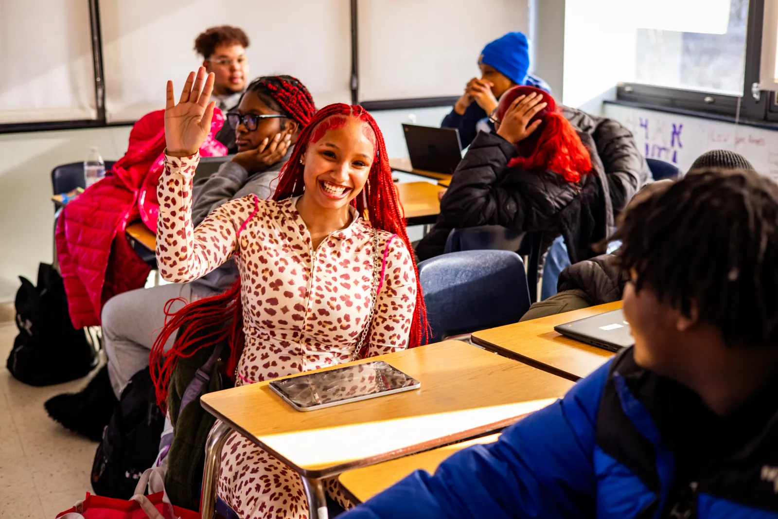 Freire Wilmington student raising her hand in class